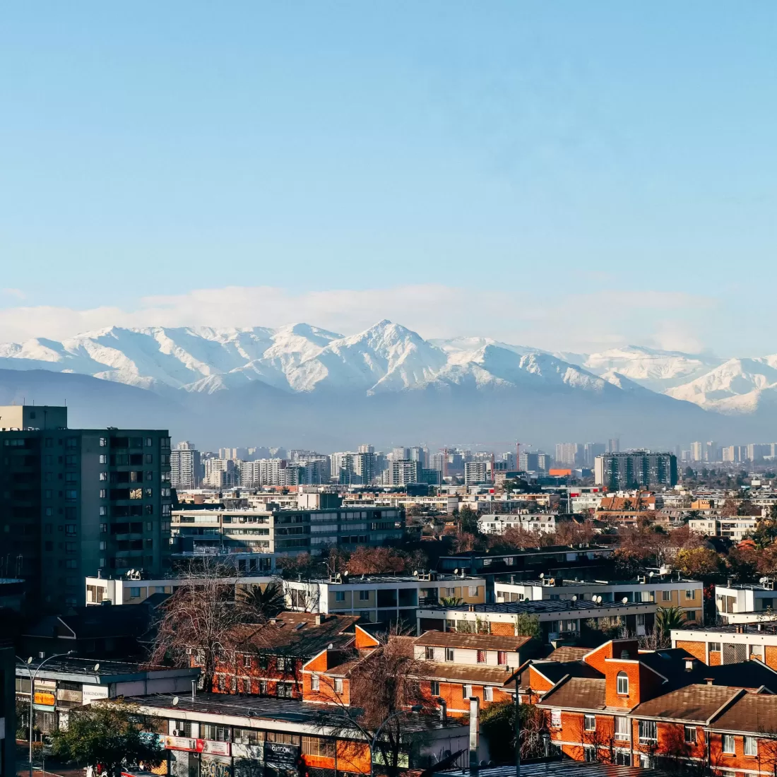 Santiago city skyline with Andes mountains in the background, vibrant city view.